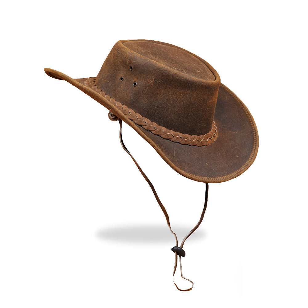 A view of the brown leather cowboy hat with an adjustable leather chin strap visible, hanging down from the sides of the hat.