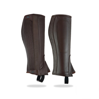 A slightly angled view of the brown leather ribbed half chaps, highlighting the color and texture of the leather.