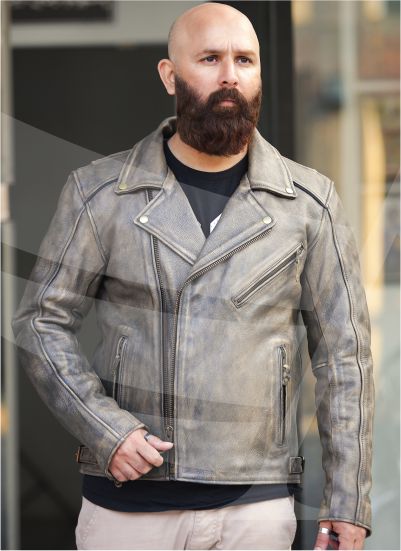 A man models a stylish distressed grey leather biker jacket with zippers.
