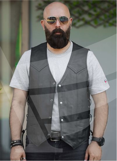A bald man with a beard models a black leather barber vest.