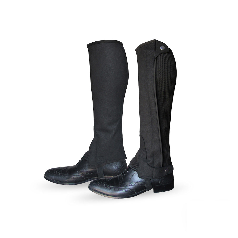 Side view of black leather riding chaps, showing the back and buckle details from a different angle.
