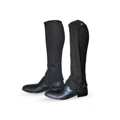 Side view of black leather riding chaps, showing the back and buckle details from a different angle.